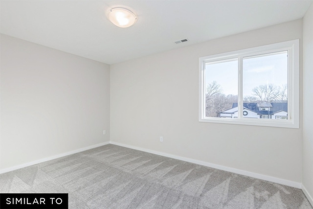 view of carpeted spare room