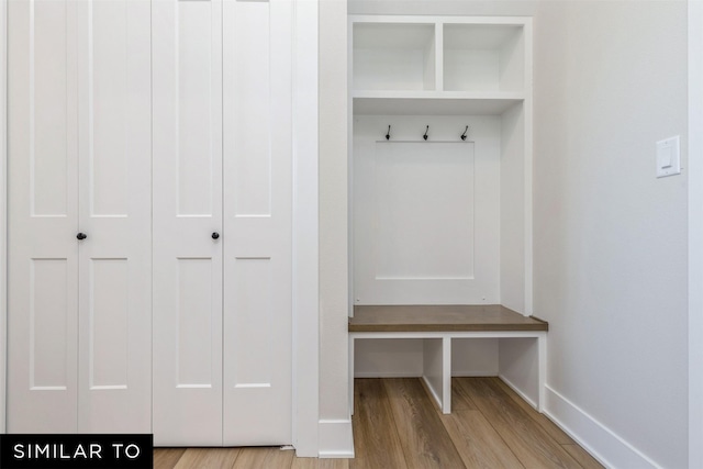 mudroom with light hardwood / wood-style flooring