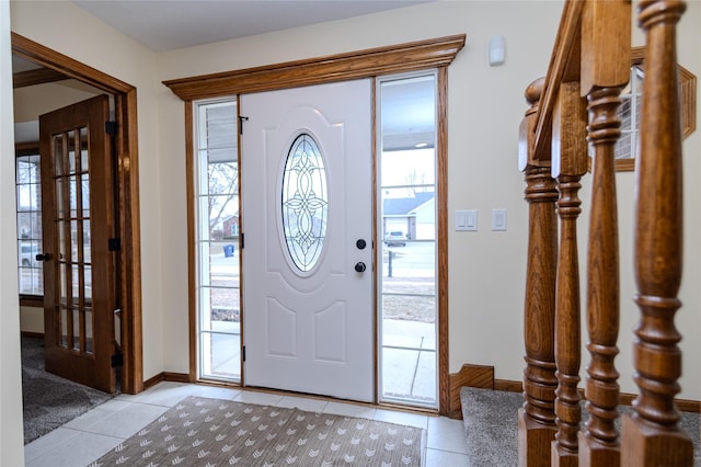 entrance foyer featuring a healthy amount of sunlight and light tile patterned floors