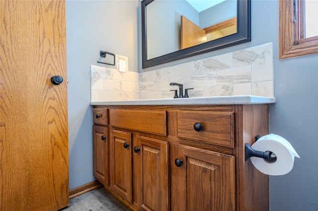 bathroom featuring backsplash and vanity