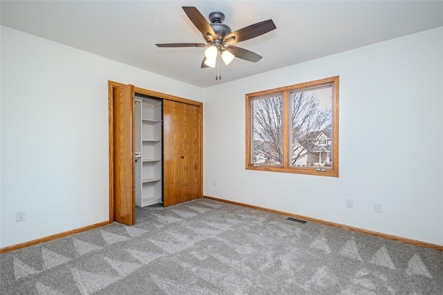 unfurnished bedroom with light carpet, baseboards, visible vents, and a closet