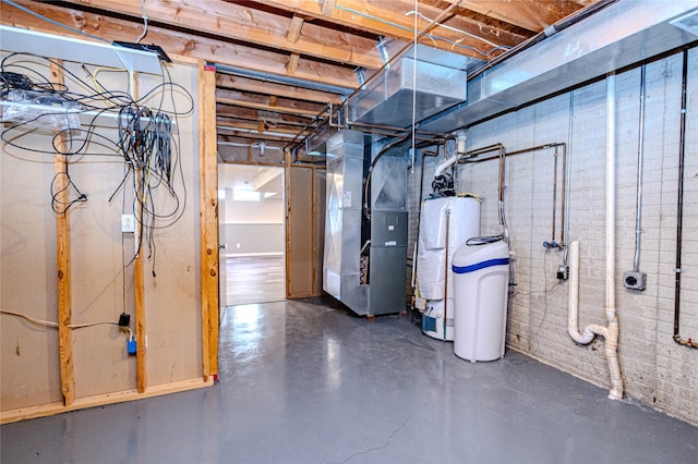 unfinished basement featuring heating unit and water heater