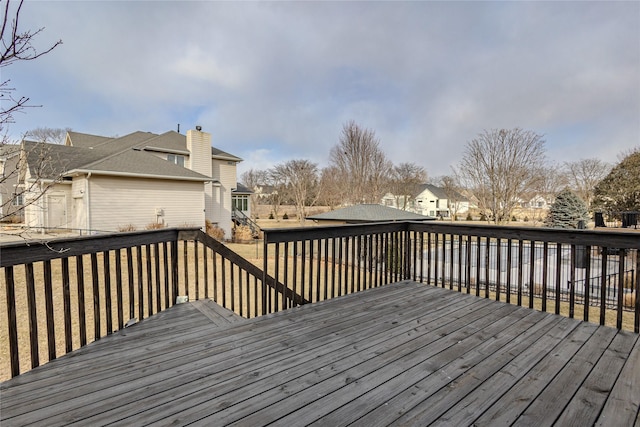 wooden deck featuring a residential view