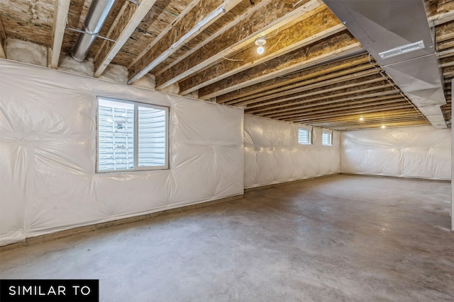 basement featuring plenty of natural light