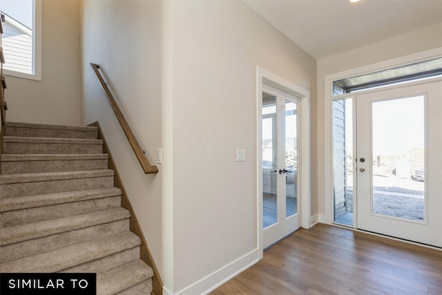 stairway featuring hardwood / wood-style floors