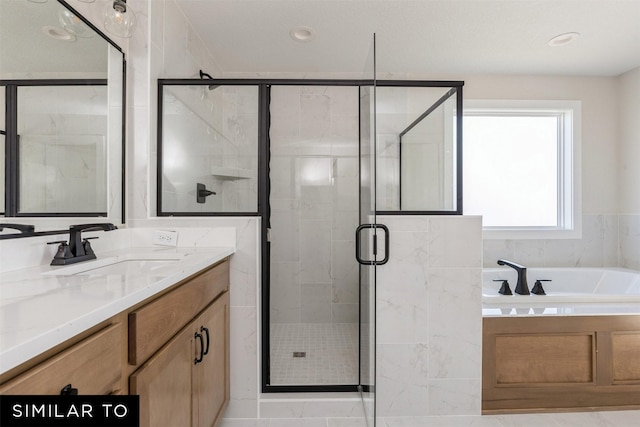 bathroom with vanity and plus walk in shower