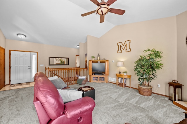 carpeted living room featuring vaulted ceiling and ceiling fan