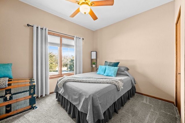 bedroom featuring ceiling fan and carpet