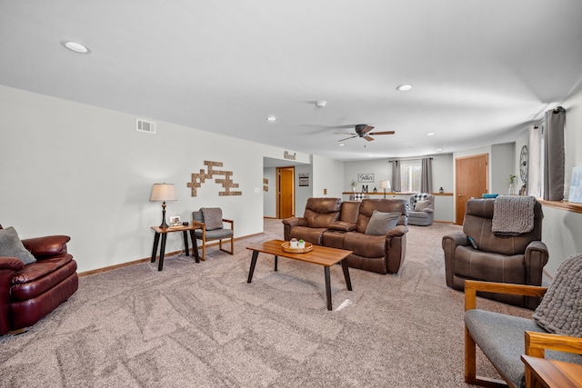 living room with light colored carpet and ceiling fan