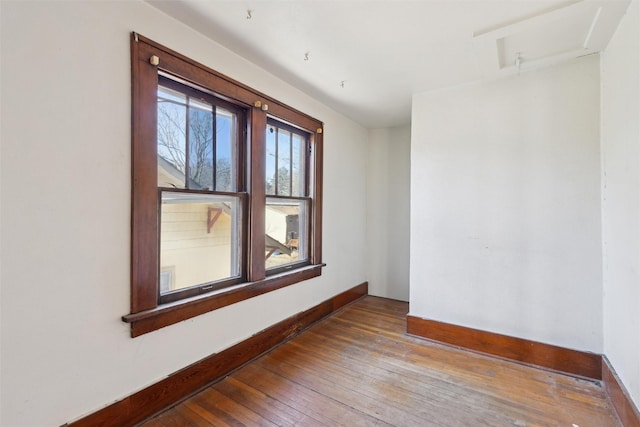 spare room with hardwood / wood-style flooring