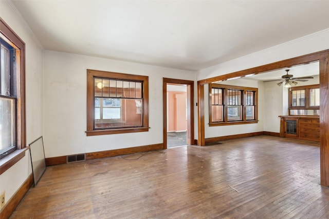 unfurnished living room with wood-type flooring