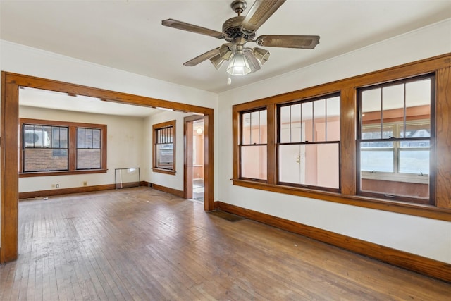 unfurnished room featuring hardwood / wood-style flooring and ceiling fan