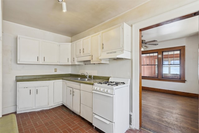 kitchen featuring sink, ceiling fan, white cabinetry, and white range with gas cooktop