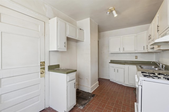 kitchen featuring sink, white range with gas cooktop, and white cabinets