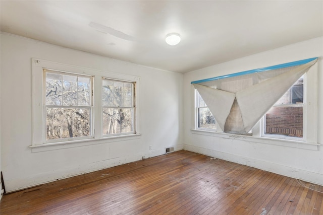 unfurnished dining area with hardwood / wood-style floors