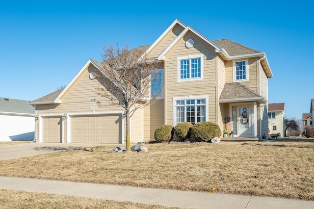 front of property with a garage and a front yard