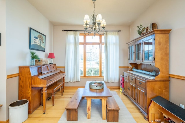 interior space featuring light hardwood / wood-style floors and an inviting chandelier