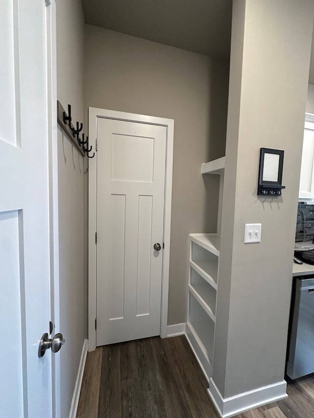 doorway with dark wood-type flooring