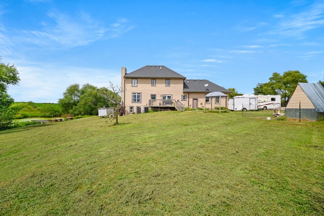 view of yard with a wooden deck and a gazebo