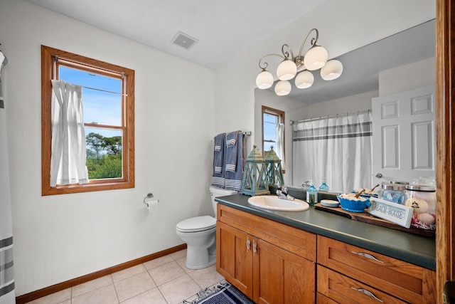 bathroom with tile patterned floors, toilet, walk in shower, a notable chandelier, and vanity