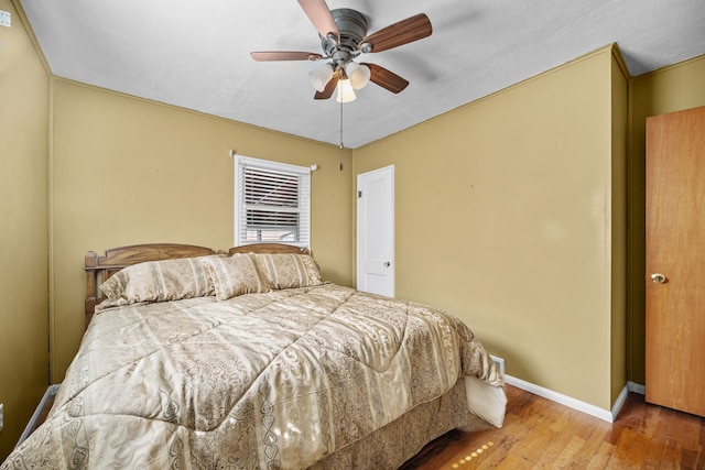 bedroom featuring ceiling fan and wood-type flooring