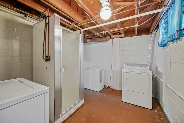 washroom with washing machine and clothes dryer