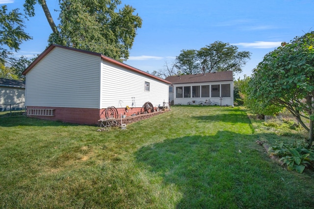 rear view of property with a yard