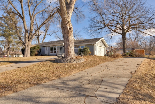 ranch-style house featuring a garage