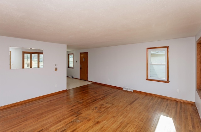 empty room with light wood-type flooring