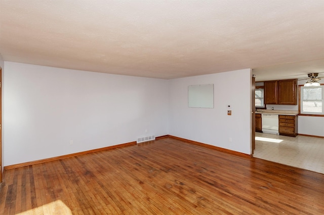 spare room with ceiling fan and hardwood / wood-style floors