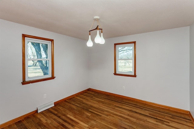 unfurnished room featuring hardwood / wood-style flooring