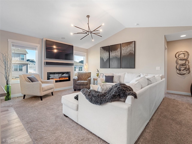 living room featuring vaulted ceiling, carpet flooring, and an inviting chandelier