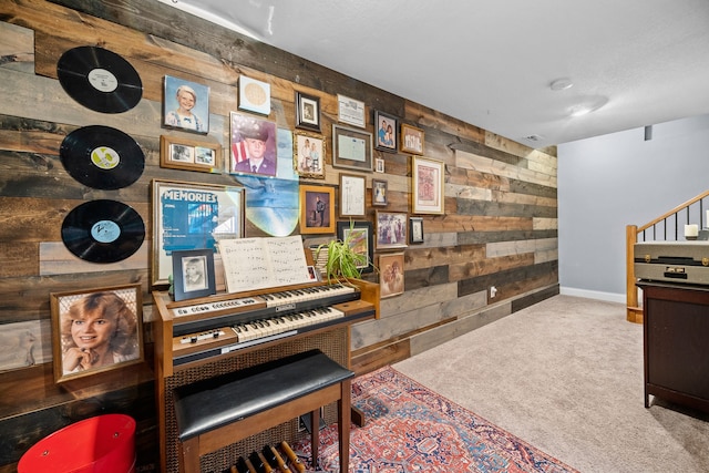 miscellaneous room featuring carpet flooring and wooden walls