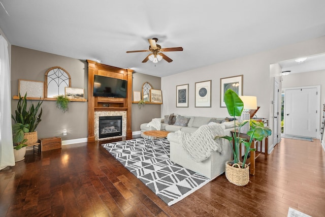 living room featuring hardwood / wood-style flooring and ceiling fan