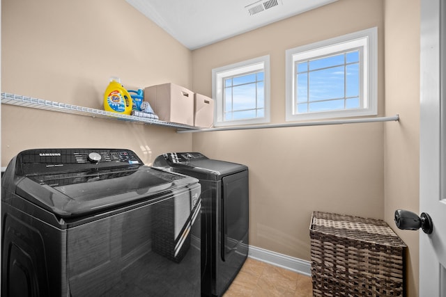 washroom featuring independent washer and dryer