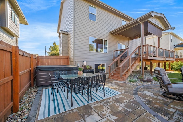 view of patio / terrace with a hot tub