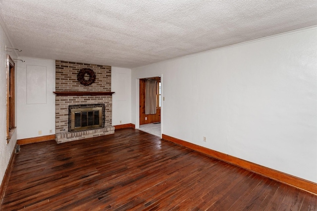 unfurnished living room featuring a fireplace, a textured ceiling, and dark hardwood / wood-style flooring