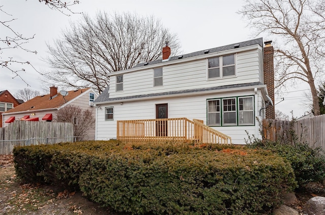 rear view of property with a deck