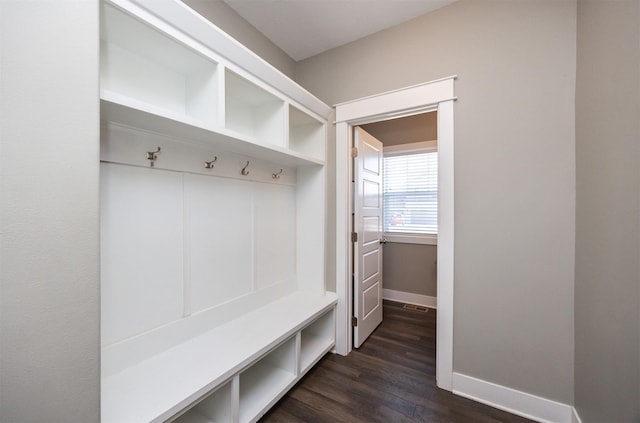 mudroom with dark hardwood / wood-style floors