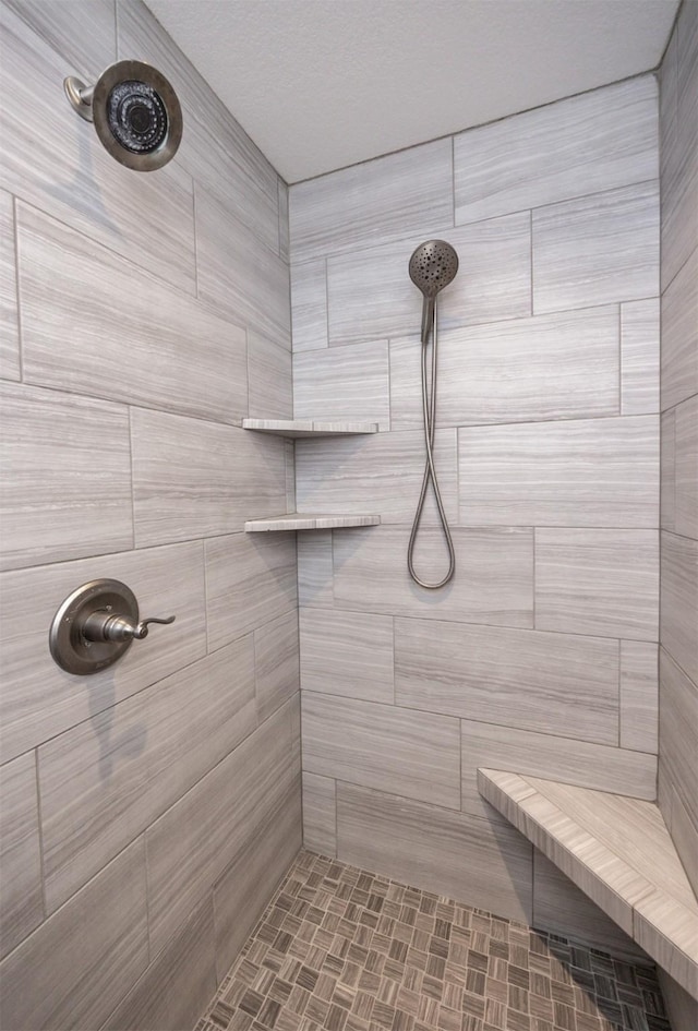 bathroom featuring tiled shower