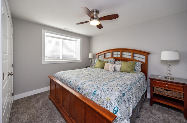 bedroom with dark colored carpet and ceiling fan