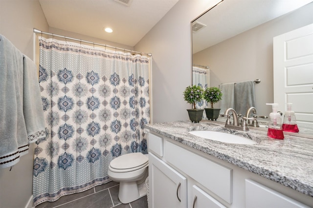 bathroom featuring curtained shower, toilet, vanity, and tile patterned flooring