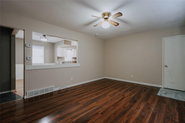 unfurnished room featuring ceiling fan and dark hardwood / wood-style floors