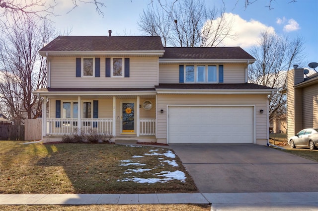 view of front property featuring a porch, a garage, and a front yard