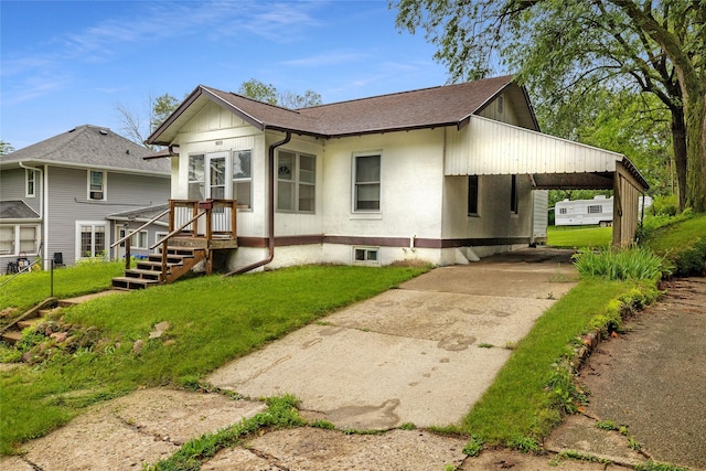 rear view of house with a yard