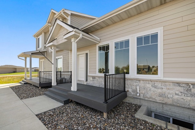 wooden terrace featuring covered porch