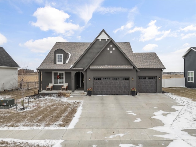 view of front of home featuring covered porch and a garage