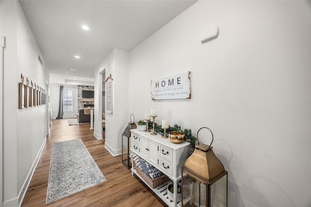 corridor featuring hardwood / wood-style flooring