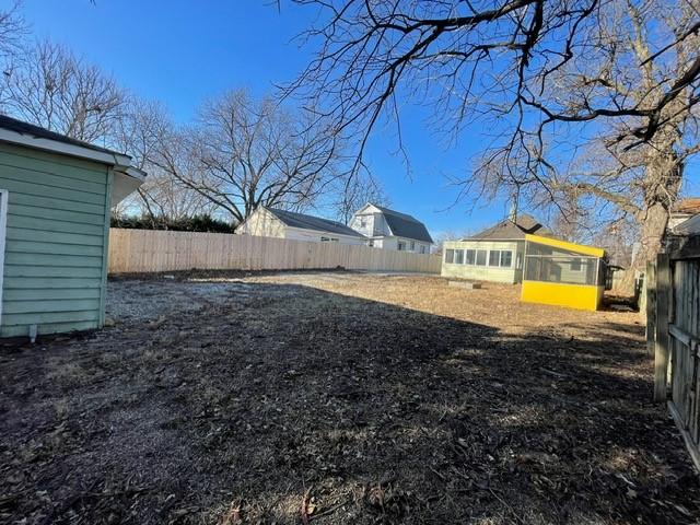 view of yard with a sunroom