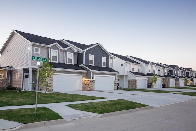 multi unit property featuring a garage and a yard